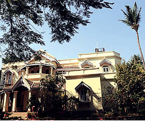 (Top) Villa Potti Patti which dates back to the 1920s; (clockwise from the left) Vidyullatha Reddy; the no-frills accommodation, cosy dining room;