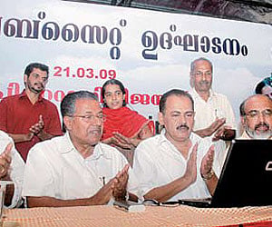 CPM state secretary Pinarayi Vijayan taking a look at the website of the Left Democratic Front after launching it in Kochi on Saturday. Desabhimani re