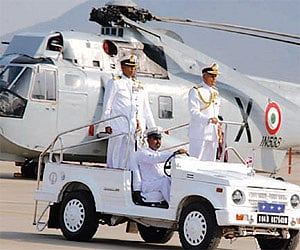 Chief of Eastern Naval Command Vice Admiral Nirmal Verma driving past a UH 3H helicopter at INS Dega in Visakhapatnam on Tuesday.
