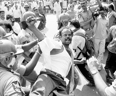 Police arresting BJP activists during a Chalo Raj Bhavan procession in Hyderabad on Sunday.