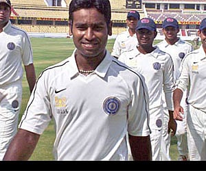 Alfred Absolom, who captured five wickets, leads the Hyderabad team back to the pavilion at the Rajiv Gandhi International Stadium on Wednesday.