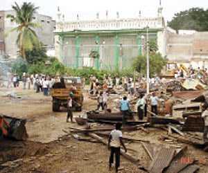 The illegal structures near the Badshahi Ashoor Khana in the Old City which were razed by the Archaeology and Museums Department on Wednesday.