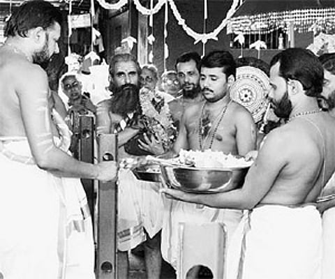 Thantri Kandararu Rajivaru performing utsavabali ritual, as part of the annual festival, at the Sopanam of Sabarimala Lord Ayyappa Temple on Tuesday.