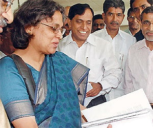 Professor Upinder Singh goes through a copy of her book before releasing it at Osmania University on Friday.