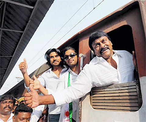 GLAMOROUS LAUNCH: Actor Allu Arjun, PRP chief Chiranjeevi and his son and filmstar Ramcharan Tej in an upbeat mood prior to the flagging off of the Pr