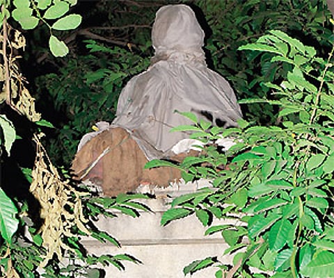 The statue of Thiruvalluvar that was ready to be unveiled but never was, has since been living under cover.