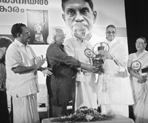 Cultural Minister M.A.Baby and Adoor Gopalakrishnan jointly presenting the J C Daniel Award 2008 to K Ravindranathan Nair at a function held in Kollam