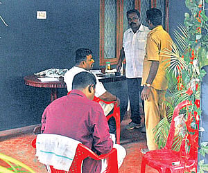 Officials lifting fingerprints from the scene of crime, at MGR Gardern, in the city on Monday.