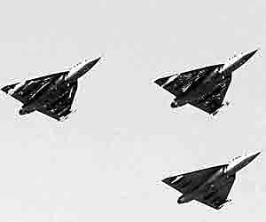 The Light Combat aircraft fly during the inauguration of the Aero India 2009 in Bangalore.