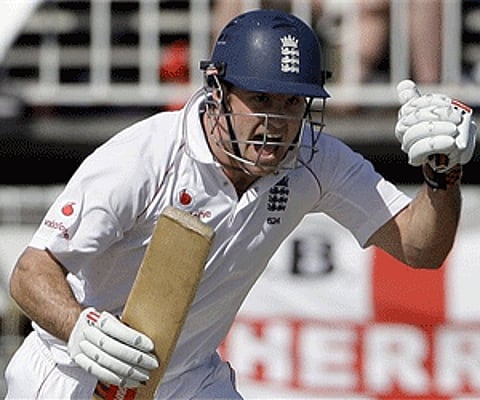 England's captain Andrew Strauss reacts after playing a shot to reach a century during the first day of the third cricket Test match. (Photo: AP)