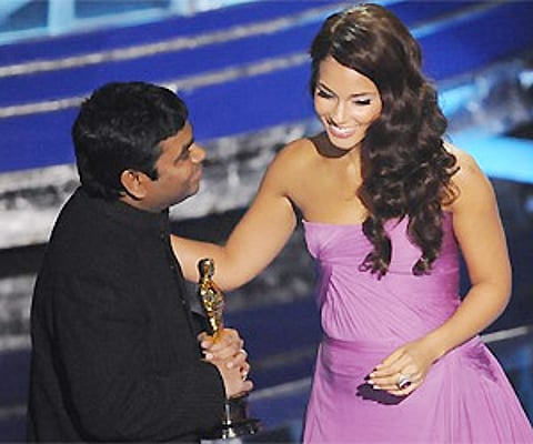 A.R. Rahman, left, accepts the Oscar for best original song "Jai Ho" from Alicia Keys during the 81st Academy Awards. AP