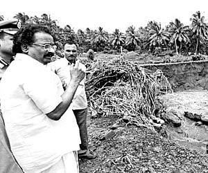 Electricity Minister A K Balan visiting the Moolathara dam site in Palakkad on Sunday.