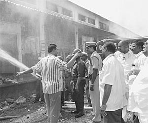 Guntur MP Rayapati Sambasiva Rao overseeing the firefighting exercise at CWC godown in Guntur on Sunday.