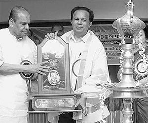 Nagaland Governor K Sankaranarayanan presenting the Sivapadmam Puraskaram to ISRO chairman G Madhavan Nair at Guruvayur on Wednesday. M Leelavathi and