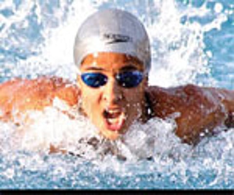 SUPER TEEN: Arhata Magavi of Karnataka on her way to setting a record in the 100m butter fly stroke in the 63rd Senior National Aquatic Championship.