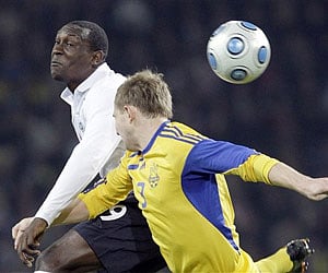England's Emlie Heskey, left, tackles Ukraine's Oleksander Kucher during the World Cup qualifying soccer match between England and Ukraine. (AP)