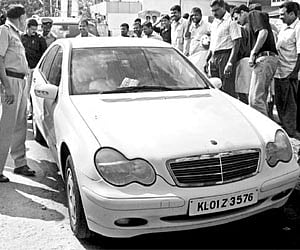 Police examining the the Mercedes-Benz car near Jawaharlal Nehru International Stadium in Kochi on Monday.