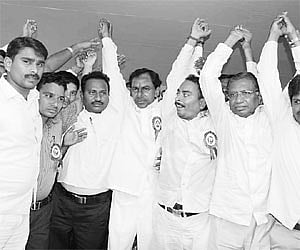 TRS chief K Chandrasekhar Rao waving to the crowd along with student union leaders at a meeting at Kakatiya University in Warangal on Monday.
