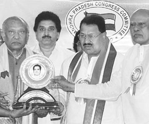 Chief Minister K Rosaiah presenting Kommineni Seshagiri Rao Memorial Award to Legislative Council chairman K Chakrapani in Hyderabad on Tuesday. PCC