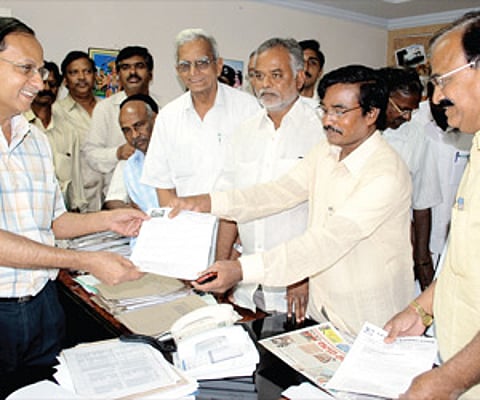 APSRTC JAC leaders serving strike notice on Executive Director BSR Murthy at Bus Bhavan in Hyderabad on Thursday.