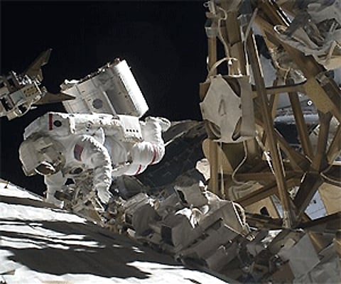 In an image provided by NASA, astronaut Mike Foreman performs a task on the exterior of the International Space Station during the space walk. AP