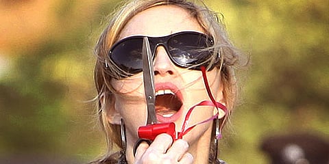 Madonna gestures after cutting the ribbon at the ground breaking ceremony for the Raising Malawi Academy for Girls in Malawi.(AP)