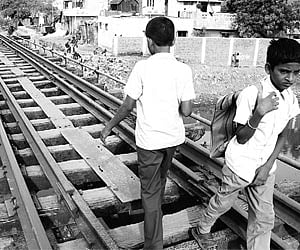 Students cross the rail track at Kodungaiyur.