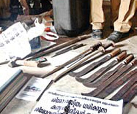 Weapons and posters recovered by the police from Edakkad on Monday.