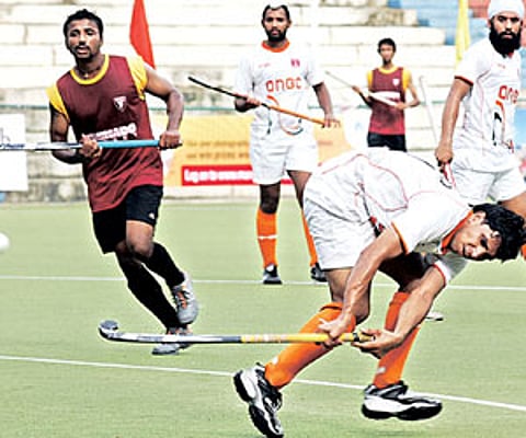 ONGC’s Sandeep Antil is about to score against Karnataka in the MCC-Murugappa Gold Cup at the Mayor Radhakrishnan Stadium in Chennai on Thursday.