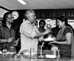 Forest Minister Binoy Viswam presenting the Swathi-Ayyappa Panicker literary award to S V Aryambika in Thiruvananthapuram on Monday. ENS