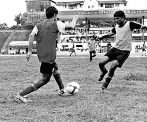 Young aspirants give everything even on an uneven surface during the trials for a new professional club at the Maharaja’s College Stadium on Wednesda