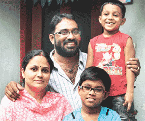 Radhakrishnan Mangalath with his wife Lathika and sons Krishnanunni and Unnikrishnan.
