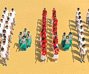 Students make a 11-11-11 sign | A RAJA CHIDAMBARAM