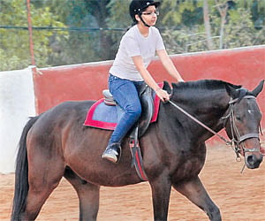 Children learning horse riding at the Hyderabad Polo & Riding Club in Gandipet