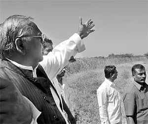 R ajya Sabha MP V Hanumantha Rao showing Shikam lands of Kalvakolu tank in Dubbacherla village in Maheshwaram mandal of Rangareddy district on Friday.