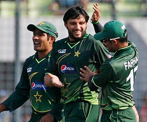Shahid Afridi celebrates with teammates the dismissal of Rubel Hossain during their first ODI in Dhaka on Thursday, Dec. 1, 2011. (AP)