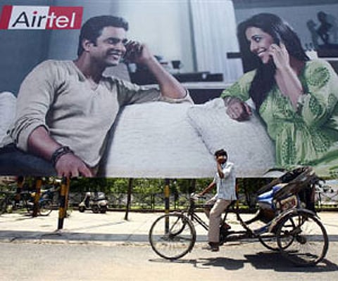 A billboard displaying telecom leader Bharti Airtel's campaign is seen in Chandigarh May 26, 2009. (Reuters)