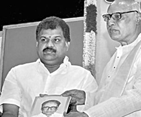 Governor K Rosaiah handing over the first copy of a souvenir of O V Alagesan to Union Minister G K Vasan in the city on Friday | EPS
