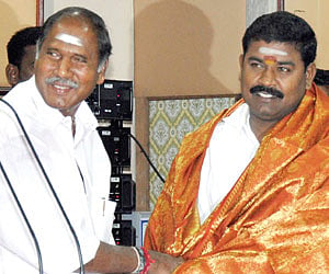 Chief Minister N Rangasamy greeting TPR Selvam, who assumed charge as Deputy Speaker on Wednesday.