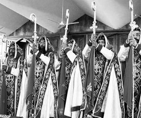 The seven newly ordained bishops of the Malankara Orthodox Church seen in ceremonial robes and holding the crosier, after the consecration ceremony he