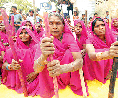 Clockwise from top: women gathered for a Gulabi gang meeting in Banda; Sampath Pal, the feisty leader and founder of the Gulabi Gang, telling people