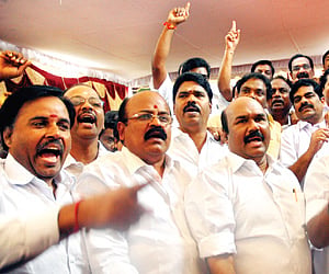 AIADMK MLAs staging a walk-out after the Speaker refused to allow them to raise questions on contentious issues in the Assembly on Tuesday. (EPS)