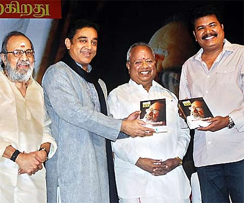Actor Kamal Hassan releasing a book on Tamil film songs and the first copy was received by Director Shankar. Also seen (from Left) are actor Surya, mu
