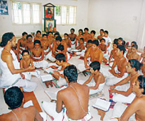 Scholar S Giridara Ganapady teaching veda to the students at the veda pathsala at Ramanathapuram in Palakkad