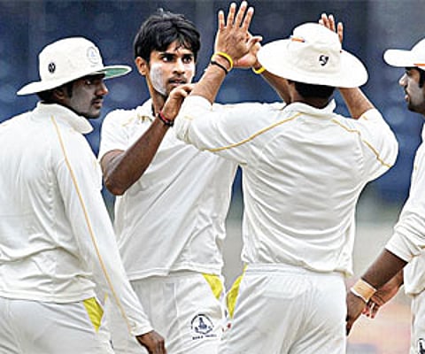 Jagannathan Kaushik (centre) took 28 wickets in his debut Ranji season.