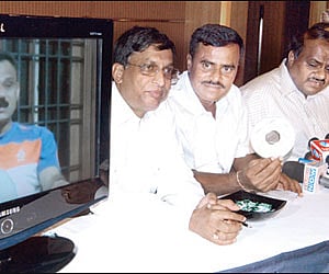JD(S) state president Kumaraswamy with Gubbi MLA Srinivas showing a CD in Bangalore on Thursday.