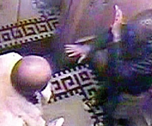 This CCTV image shows Abdulaziz (R) reacting after having been kicked and punched by al Saud in a lift.
