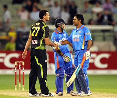 MS Dhoni shakes hands with Australia's Clint McKay after India win by 8 wickets during the Twenty20 match at MCG in Melbourne on Friday. (AP)