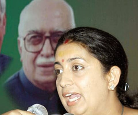 Smriti Irani addressing media persons in Bhubaneswar on Friday | EXPRESS PHOTO