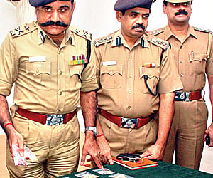 City police commissioner AK Khan showing the weapons recovered from the kidnapper gang in Hyderabad on Monday. ENS